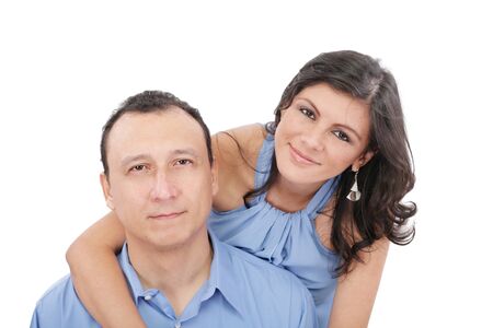 Portrait of loving couple hugging man from behind の写真素材