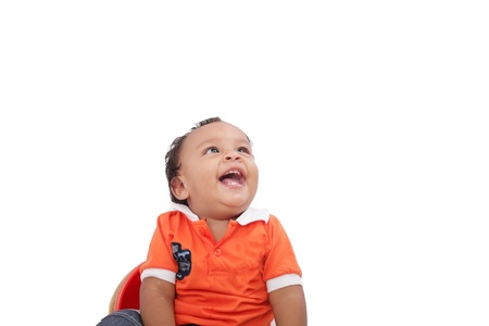 Baby laughing over white background. Active one year child の写真素材