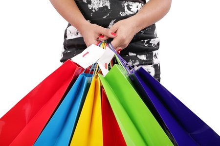 woman hands holding shopping bags isolated on white. Focus on handsの写真素材