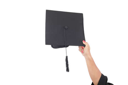 hand throwing graduation hats in the air の写真素材