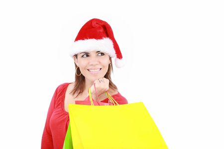 Shopping Christmas woman smiling. Isolated over white background の写真素材