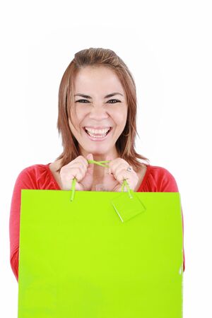 Young woman with shopping bags over white background の写真素材