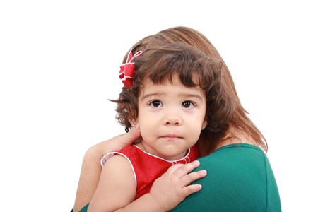 Portrait of a mother hugging her daughter, isolated over white 
の写真素材