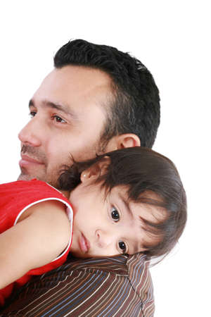 beautiful little girl hugging embracing her father.  Focus in the little girl.
の写真素材