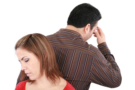 Young couple standing back to back having relationship difficulties. Focus on womanの写真素材