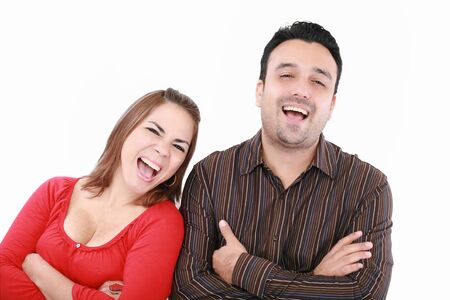 Portrait of an excited young couple on white backgroundの写真素材