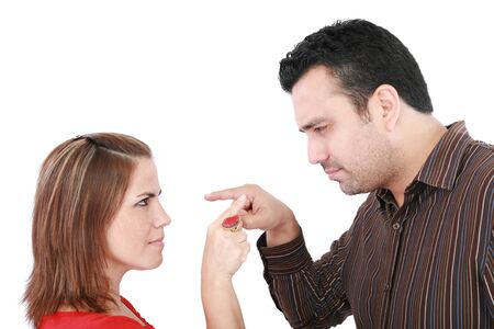 Young couple pointing at each other against a white background 
の写真素材