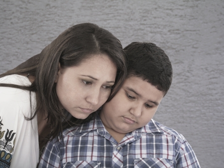 mother and son with sad expression の写真素材