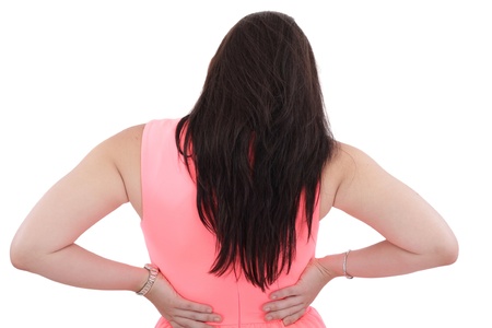 Business woman with back pain isolated over white backgroundの写真素材