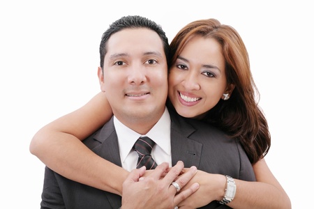 Portrait of loving couple hugging man from behindの写真素材