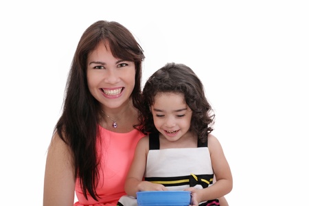 Happy portrait of beautiful young mother with little pretty daughter - isolated on whiteの写真素材