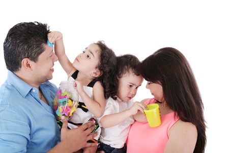 portrait of a nice family playing on white の写真素材