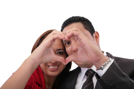 Happy couple in love showing heart with their fingers の写真素材