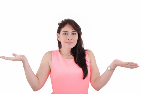 Portrait of a pretty young woman gesturing do not know sign against white backgroundの写真素材