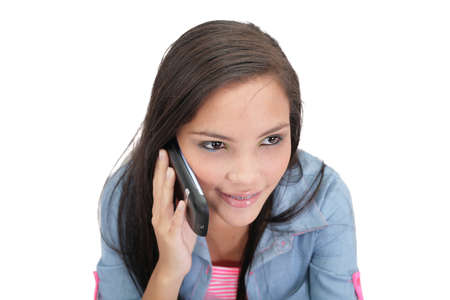 A pretty young woman talking on her cellphoneの写真素材