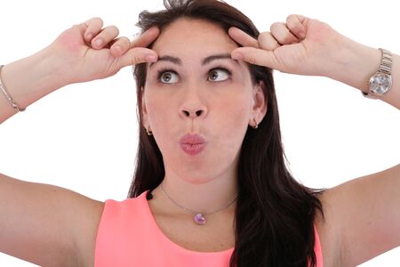 Portrait of a funny young woman looking up on isolated background の写真素材