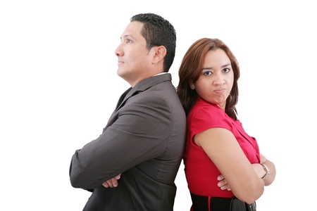 Young couple standing back to back having relationship difficulties on white background の写真素材