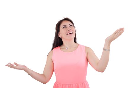 Shocked and excited woman looking up, isolated on whiteの写真素材