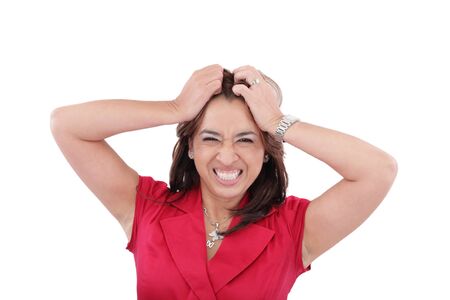 Woman looking shocked and angry against white background の写真素材