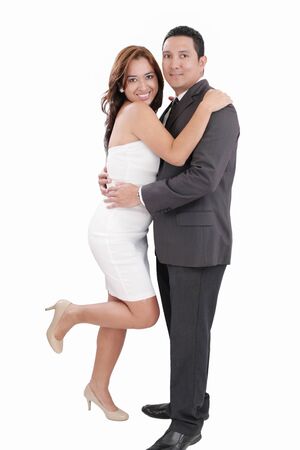 Young happy couple love smiling, standing full length portrait, looking at camera, isolated over white backgroundの写真素材