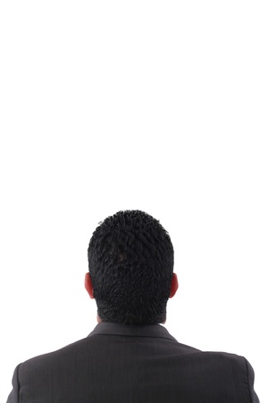 back of pensive businessman looking up isolated on white background の写真素材