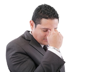 Business man with a head ache, isolated on white background の写真素材