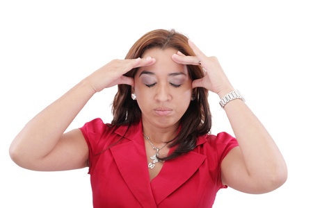 A young woman with a headache holding head, isolated on white background の写真素材