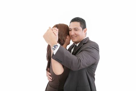 young couple dancing over white backgroundの写真素材