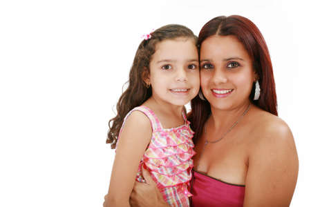 Young latin mother hugging her daughter isolated on a white backgroundの写真素材
