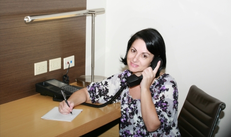 Young woman sitting ready to take notes  の写真素材