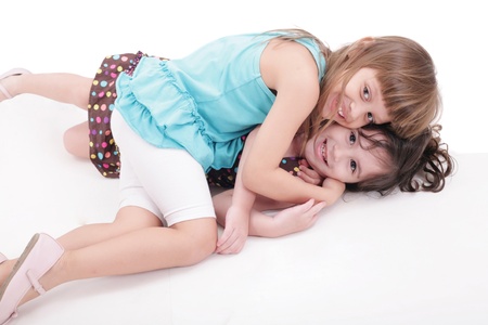 two kids play together, isolated on white background の写真素材