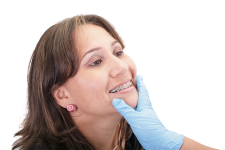Woman checking his routine brackets on her dentistの写真素材