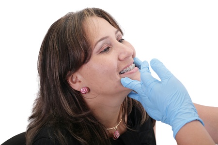 Female patient looking treating at her dentistの写真素材