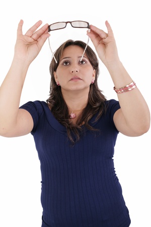 hispanic young woman checking her eyeglassesの写真素材