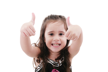 Close up portrait of cute girl showing thumbs up.Isolated on whiteの写真素材