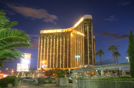 LAS VEGAS - FEB 3: Sunset view of Mandalay Bay Hotel and Casino on the Las Vegas Strip, Nevada Feb 3, 2014. The gold coloring of the hotel is a result of gold leaf used on the windows.のeditorial素材