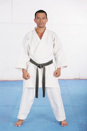 Black belt karate ready to start the trainingの写真素材