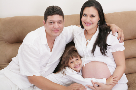 Hispanic family expecting new babyの写真素材