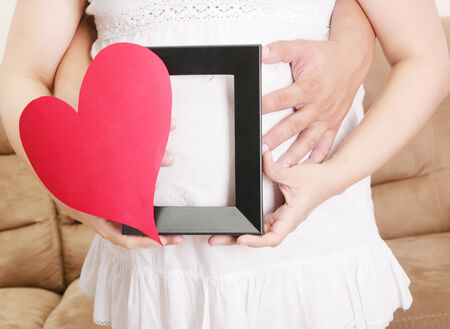 pregnant women with her husband waiting for her babyの写真素材