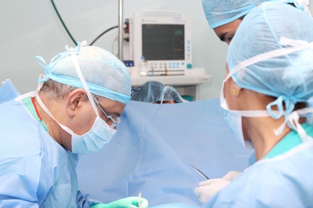 surgeons team working in the operation roomの写真素材