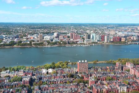 Aerial view of Boston skyline and Cambridge district separated by Charles River. Aerial view of Boston skyline and Cambridge district separated by Charles River.