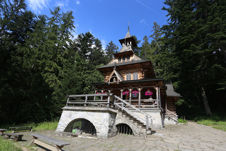 ZAKOPANE, POLAND - JUL 5: Summer view of Jaszczurowka, most famous wooden chapel in Zakopane, Poland on July 5, 2017.のeditorial素材