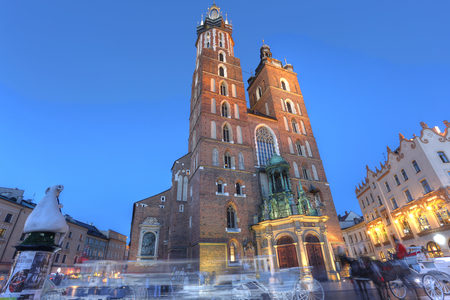 KRAKOW, POLAND - JUL 3: View of Kosciol Mariacki in market square on Jul 3, 2017 in Krakow, Poland. Church of Our Lady Assumed into Heaven is one of the best examples of Polish Gothic architecture.のeditorial素材