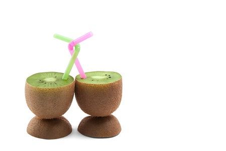 Two kiwi with twisted coctail straws isolated on a white backgroundの写真素材