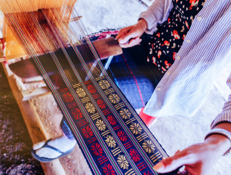 Vietnamese woman weaves by hand, Lang Biang mountain, near Dalatの写真素材