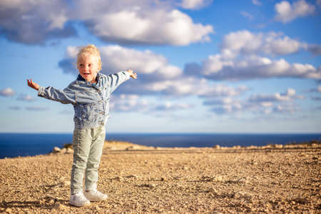 Portrait of happy child on the beach. Summer vacation concept.の写真素材