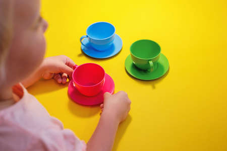 Little girl having a tea partyの写真素材