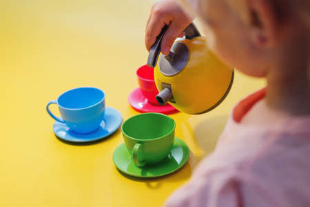 Little girl having a tea partyの写真素材
