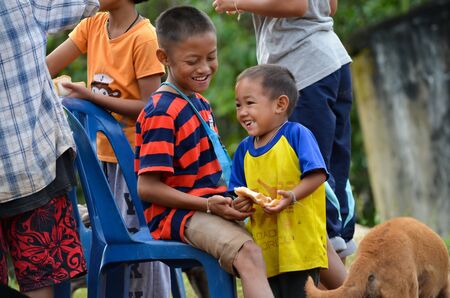 Nan, Thailand - September 10, 2019 Children living in high-hill villages, traveling difficult, are a way of life for the Lua people.のeditorial素材