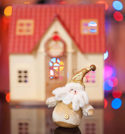 Santa Claus against the beautiful houseの写真素材